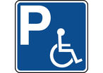 Panneau indication de parking réservé aux handicapés