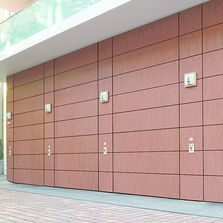 Portes sectionnelles industrielles à portillon intégré | Série 50