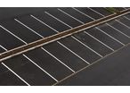 Comment rénover un sol en bitume et signaliser un parking ? 