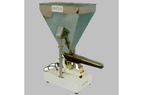 Doseur volumétrique à extracteur vibrant